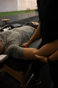 Therapist performs targeted sports massage to the subscapularis muscle.